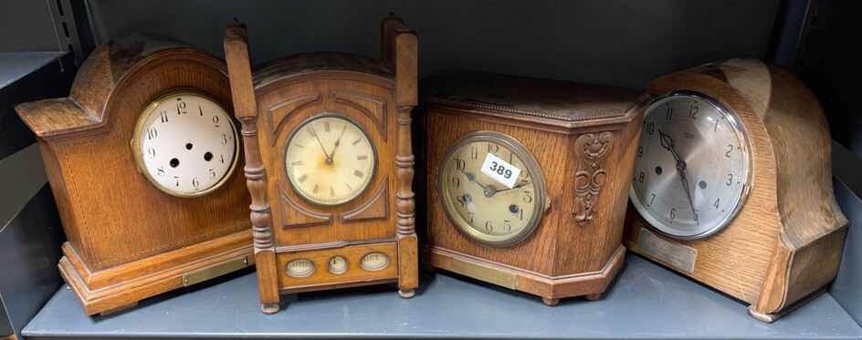 Three oak mantle clocks and a walnut desk calendar clock, H. 28cm.