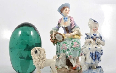 Victorian green glass dumpy paperweight, continental figures, and a small Staffordshire dog.
