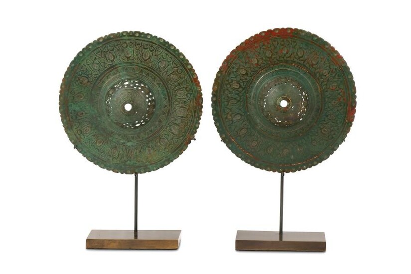 TWO PIERCED AND ENGRAVED BRONZE BOSSES Iran, 10th