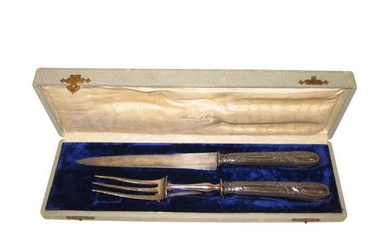 1 silver knife and fork in its case....