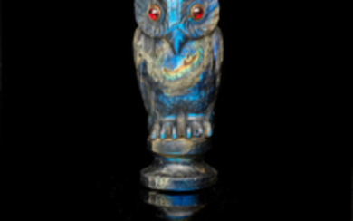 A carved labradorite seal in the form of an owl