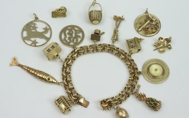 14K CHARM BRACELET WITH 15 GOLD CHARMS