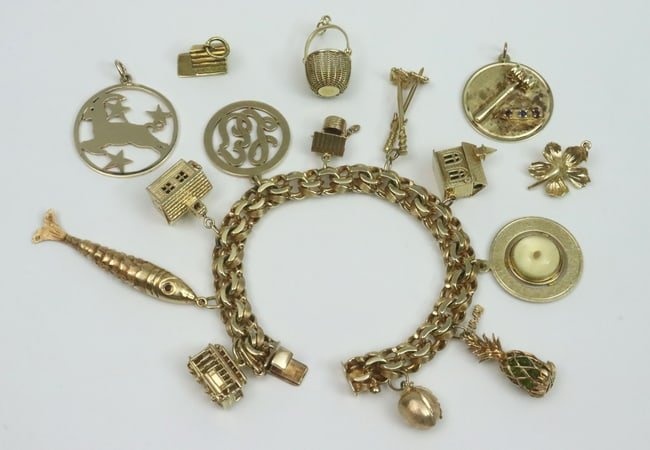 14K CHARM BRACELET WITH 15 GOLD CHARMS