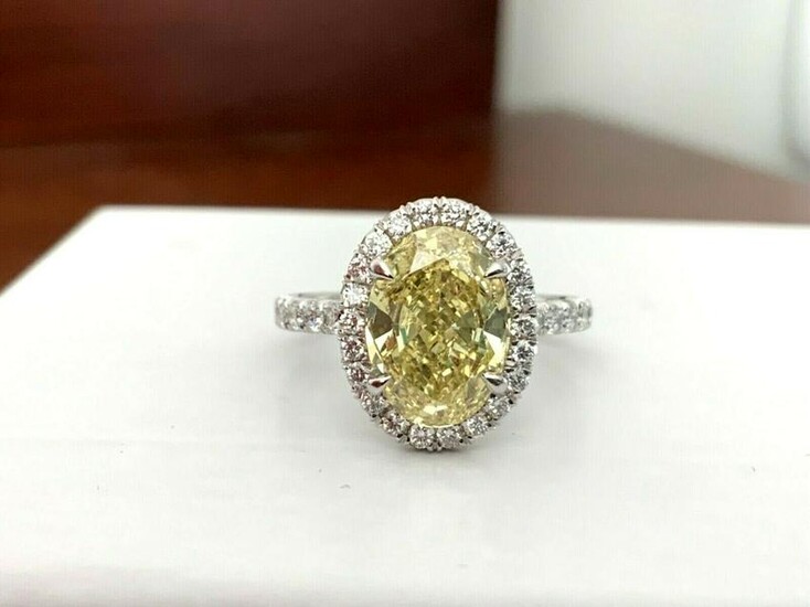 3.21 ct GIA Certified Fancy Yellow OVAL Diamond Ring