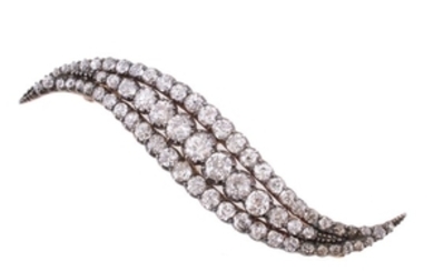A Victorian curved diamond brooch