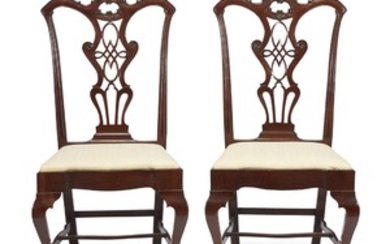 A pair of finely carved Chippendale style mahogany side...