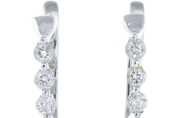 A pair of 14ct gold diamond hoop earrings.