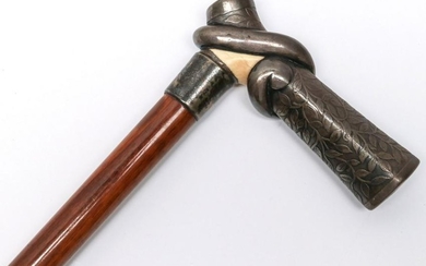 A ANTIQUE CANE WITH STERLING AND OTHER HANDLE, 1905