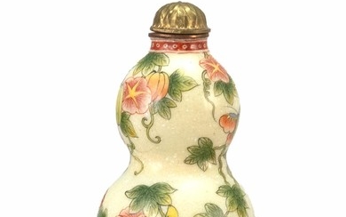BEIJING ENAMEL SNUFF BOTTLE In double gourd form, with butterfly and fruit design. Four-character Qianlong mark on base. Height 2.25...