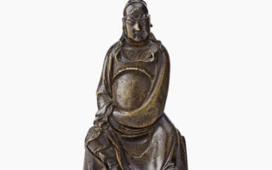 A bronze figure of a seated Daoist deity