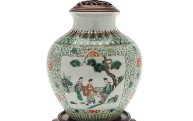 A Chinese famille verte porcelain vase, Kangxi 1662–1722. H. 22 cm. Wood base and lid.