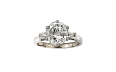 A diamond single-stone ring The central brilliant-cut diamond,...
