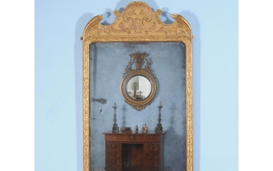 A George I giltwood and gesso girandole wall mirror