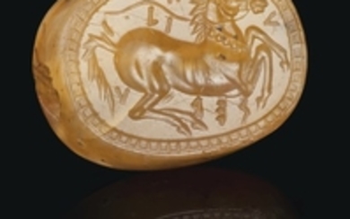 A GREEK BANDED CARNELIAN SCARABOID WITH A HORSE, CLASSICAL PERIOD, CIRCA MID 5TH CENTURY B.C.