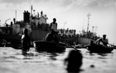 Jan Grarup: "Outside the main harbor in Port-au-Prince thousands of Haitian refugees trying to flee the country by ships". Signed Jan Grarup.