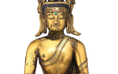 A rare gilt copper-alloy figure of crowned Buddha