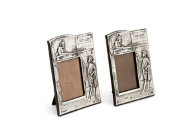 A pair of silver photograph frames