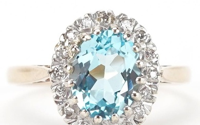 9ct gold blue topaz and diamond cluster ring, the topaz appr...