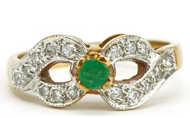 9ct gold emerald and diamond double crossover ring, size O/P...