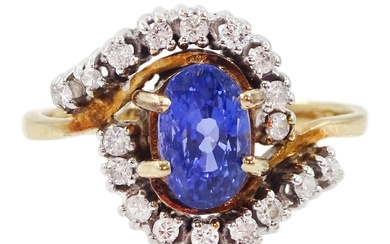 9ct gold oval cut sapphire and diamond crossover cluster ring