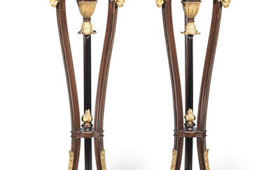 A pair of late 19th century ebonised and gilt metal mounted torcheres