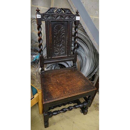 A 17th century oak dining chair, with carved panelled back, ...