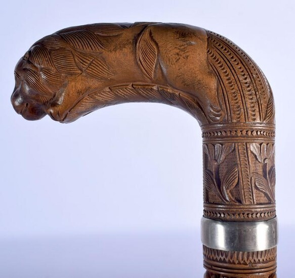 A 19TH CENTURY ANGLO INDIAN CARVED WOOD WALKING CANE