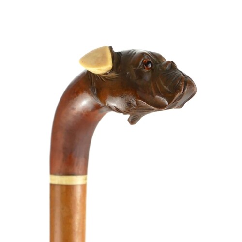 A 19TH CENTURY CARVED TREEN AND IVORY ARTICULATED DOG FORM W...
