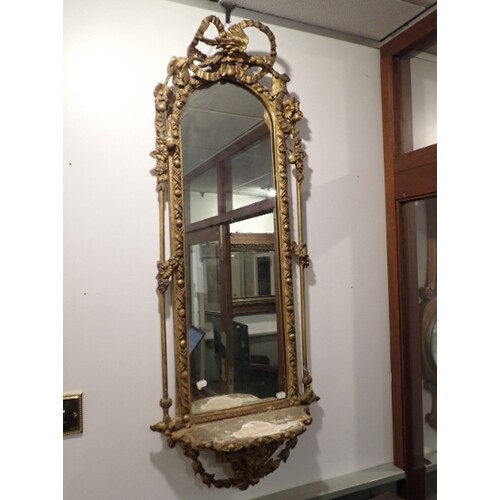 A 19TH CENTURY GILT COMPOSITION PIER MIRROR WITH SHELF the a...