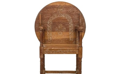 A 20th century limed oak monk's bench. With carved circular ...