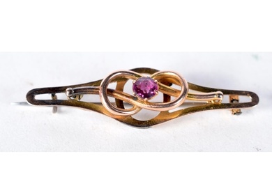 A 9 Carat Gold Bar Brooch set with an Amethyst. Stamped 9CT...