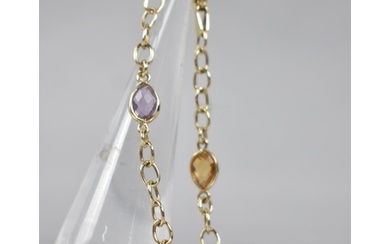 A 9ct Gold Multi-Jewelled Bracelet, Three Pear Cut Stones Co...