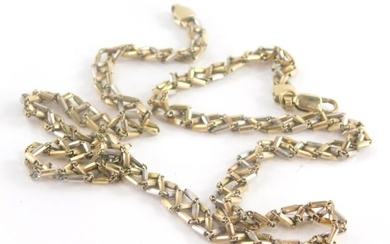 A 9ct gold bi-colour multi link chain, with raised...