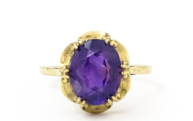 A 9ct gold dress ring set with amethyst. Ring size approx. M...