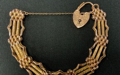 A 9ct gold fancy link gate bracelet, padlock clasp,. 1.4cm w...