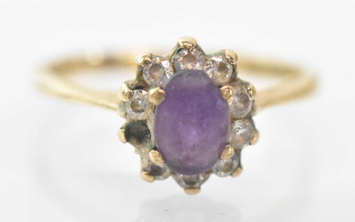A 9ct yellow gold amethyst set ring, the central amethyst...