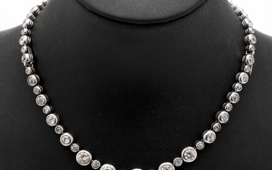 NOT SOLD. A Belle Epoque diamond necklace/bracelet set with numerous old-cut diamonds weighing a total...