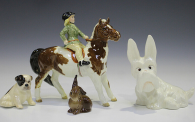 A Beswick skewbald Girl on Pony, model No. 1499 (one leg glued), together with two Beswick animals a