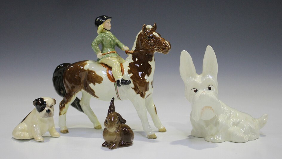 A Beswick skewbald Girl on Pony, model No. 1499 (one leg glued), together with two Beswick animals a