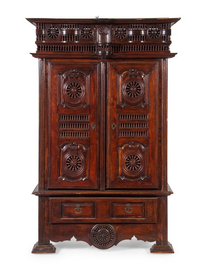 A Brittany Style Carved Walnut Armoire
