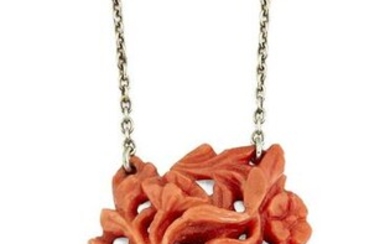 A CARVED CORAL NECKLACE, the triangular coral pendant