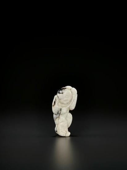 A CARVED JADE PENDANT OF A LOTUS BOY, MING DYNASTY
