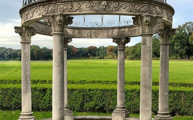 A CARVED LIMESTONE AND WROUGHT IRON MOUNTED ROTUNDA, LATE 20TH CENTURY
