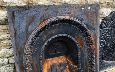 A CAST IRON FIRE SURROUND AND A GRATE.