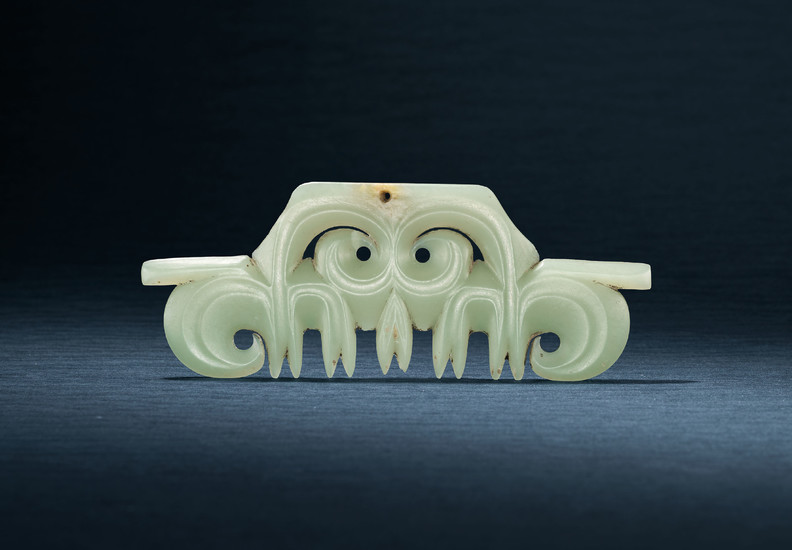 A CELADON JADE TOOTHED ANIMAL MASK ORNAMENT, HONGSHAN CULTURE, CIRCA 4000-3000 BC