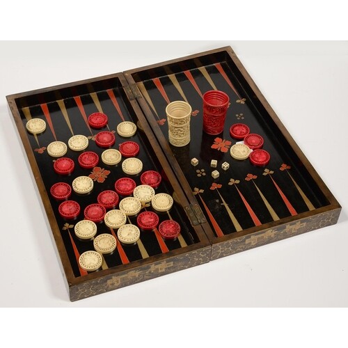 A CHINESE EXPORT BLACK AND GOLD LACQUER FOLDING GAMES BOARD,...
