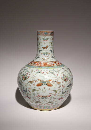 A CHINESE FAMILLE ROSE 'BUTTERFLY AND PRUNUS' BOTTLE VASE