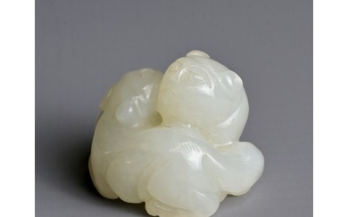 A CHINESE WHITE JADE LION GROUP PENDANT, QING DYNASTY. Carve...