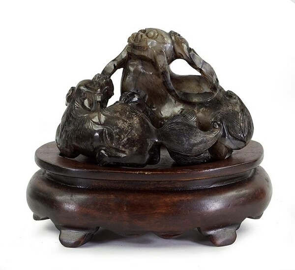 A Chinese Jade Figural Group.