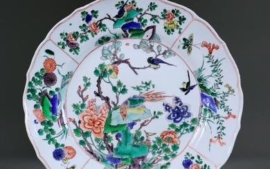 A Chinese Kangxi Famille Verte Plate, enamelled with flowering...